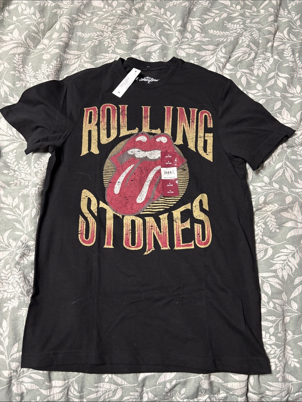 the Rolling Stones Black Tee with Red and Gold Graphic